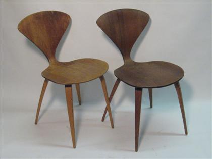 Appraisal: Cherner Pair of simple curved wooden chairs with plywood covering