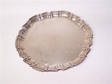 Appraisal: An Edwardian salver Sheffield of circular outline with scalloped raised