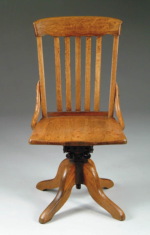 Appraisal: OAK REVOLVING DESK CHAIR Shaped seat five slat back SIZE