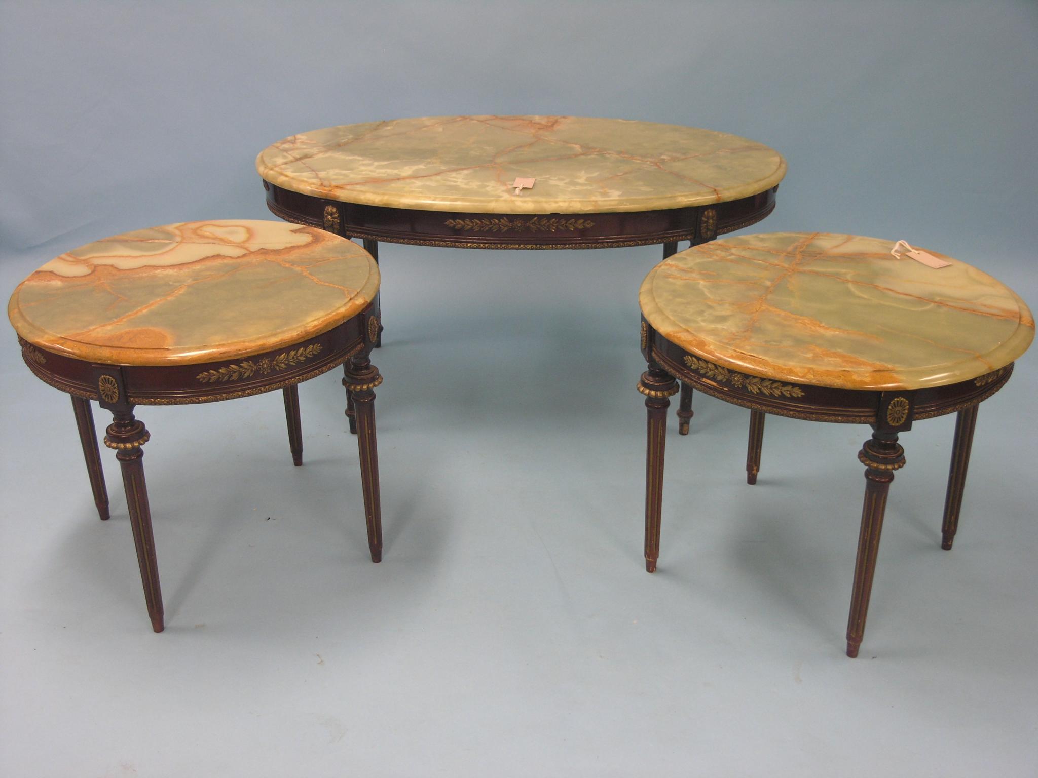 Appraisal: A pair of Louis XVI-style mahogany occasional tables circular with