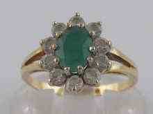 Appraisal: An emerald and white stone ring set in carat gold