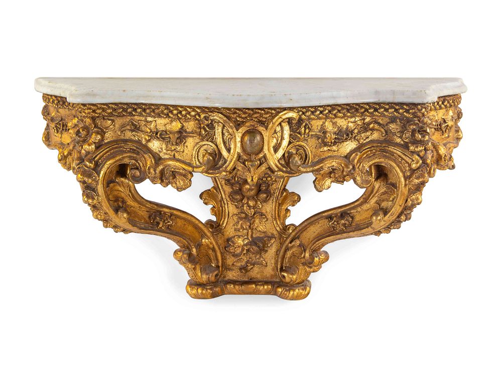 Appraisal: An Italian Rococo Carved Giltwood Marble Top Console d'Applique An