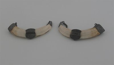 Appraisal: A pair of th century mounted boars tusk wine labels