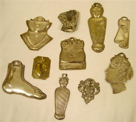 Appraisal: Collection of tin pressed metal exvotive Milagros including two babies