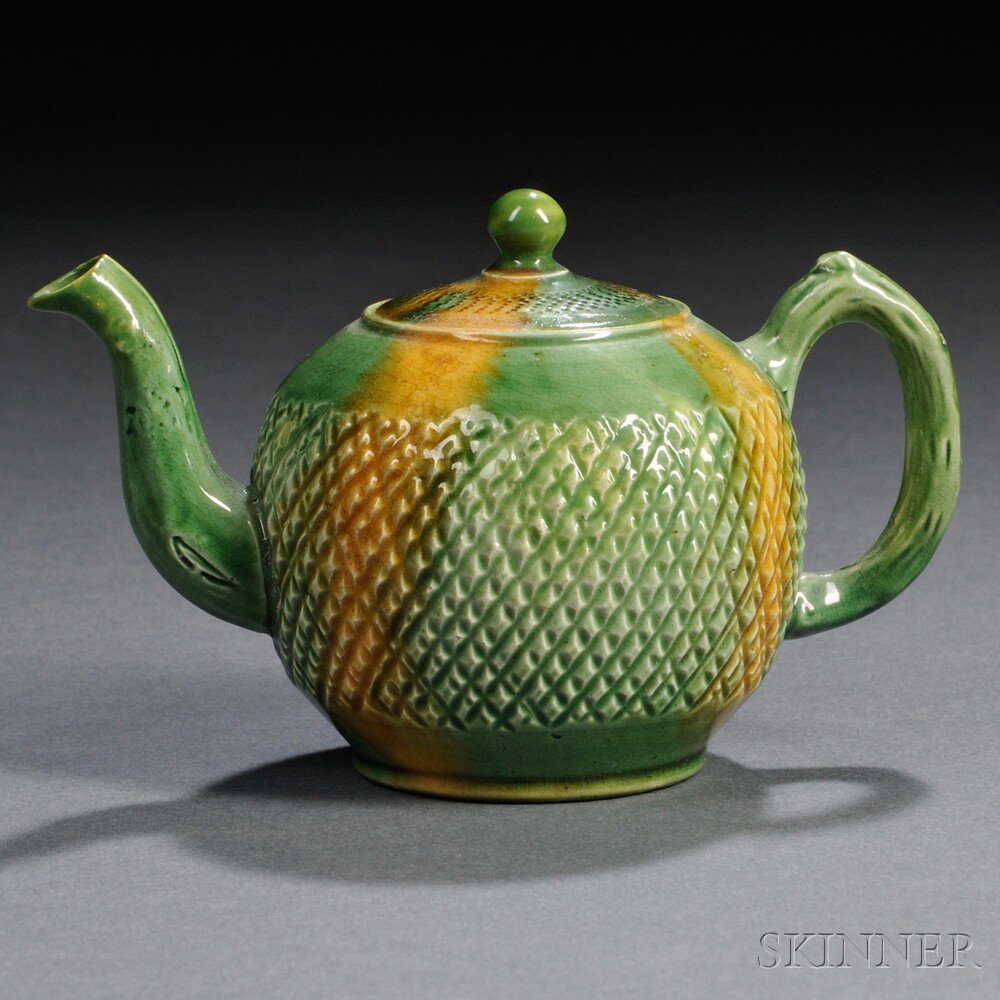 Appraisal: Staffordshire Cream-colored Earthenware Teapot and Cover England c globular shape