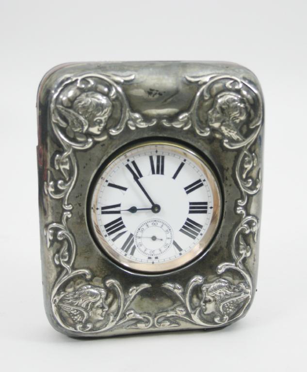 Appraisal: An Edward VII silver mounted Travelling Clock Case embossed masks