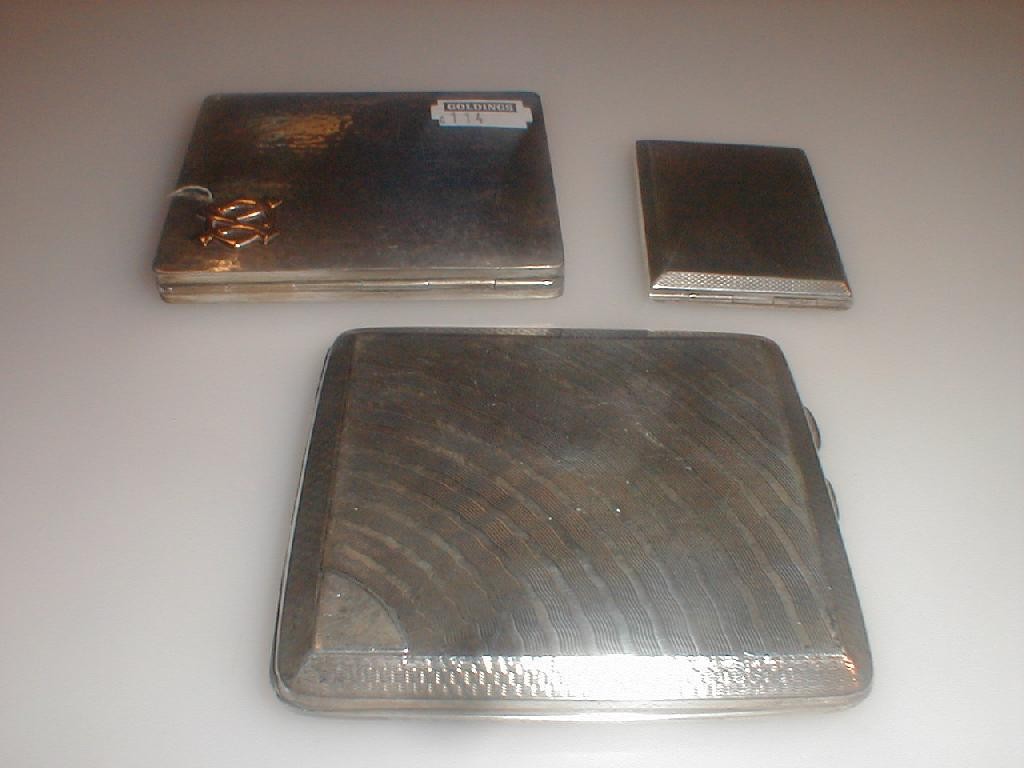 Appraisal: Two silver cigarette cases and a silver card case