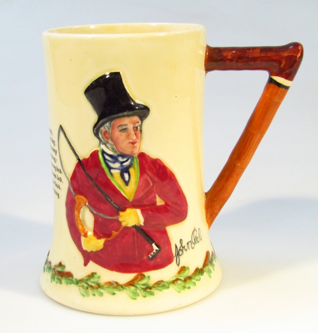 Appraisal: A Crown Devon Fieldings pottery musical tankard John Peel of