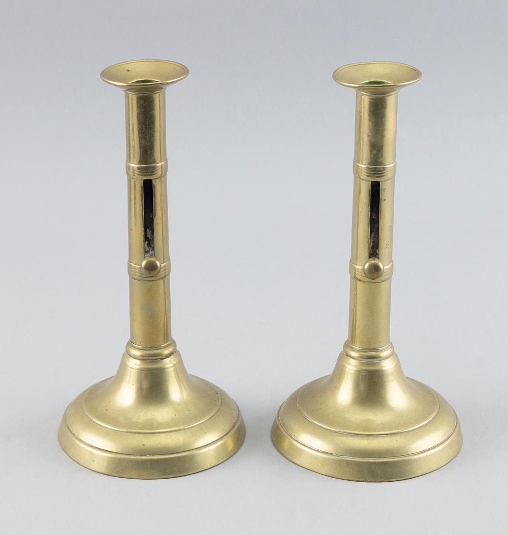 Appraisal: PAIR OF ENGLISH TURNED BRASS CANDLESTICKS FIRST HALF OF THE