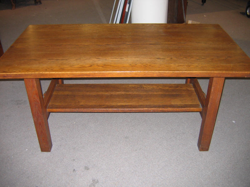 Appraisal: GUSTAV STICKLEY Oak library table with trestle board support bears