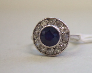 Appraisal: A sapphire and diamond set cluster ring mounted with the