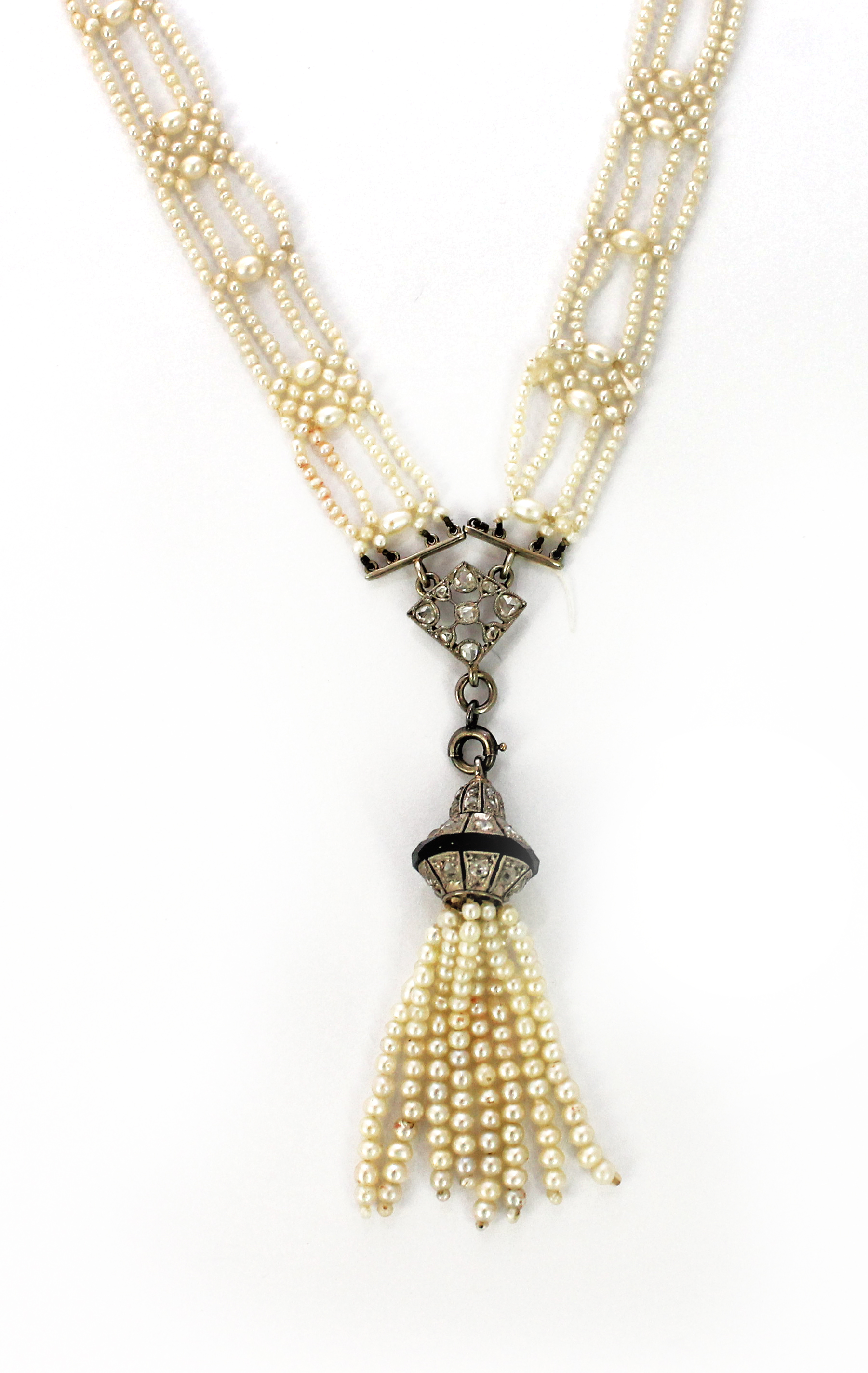 Appraisal: A seed pearl multiple row necklace the front with a