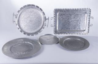 Appraisal: Hammered Aluminum Serving Trays Set of five different hammered aluminum