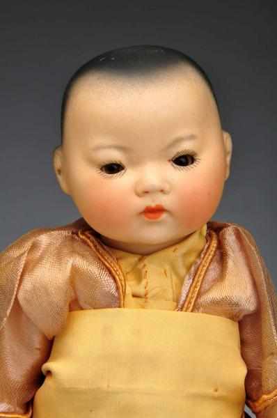 Appraisal: A M Asian Toddler Doll Description Bisque head child with