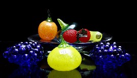 Appraisal: An assortment of Kosta Boda fruit together with a Kosta