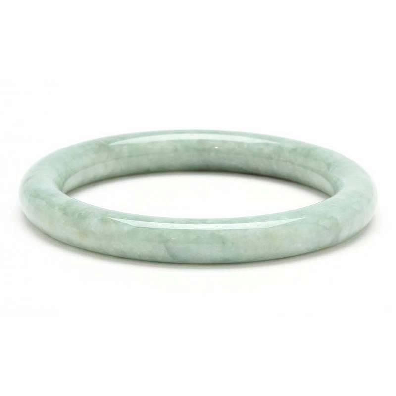 Appraisal: Vintage Jade Bracelet carved in the round of mottled green