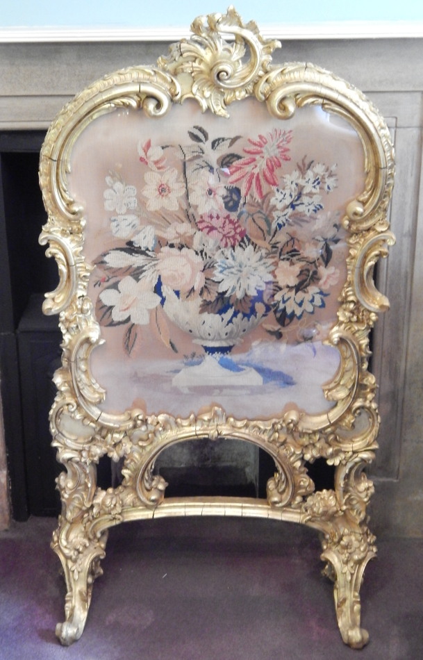 Appraisal: A thC rococo giltwood fire screen with 'C' scroll frame