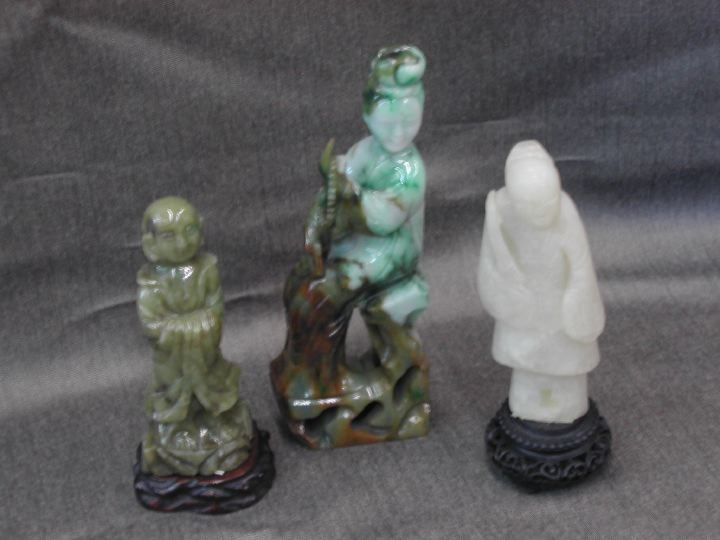 Appraisal: Group of Three Carved Figures consisting of a Chinese carved