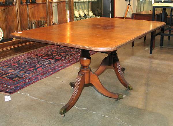 Appraisal: A George III style inlaid mahogany dining table with four