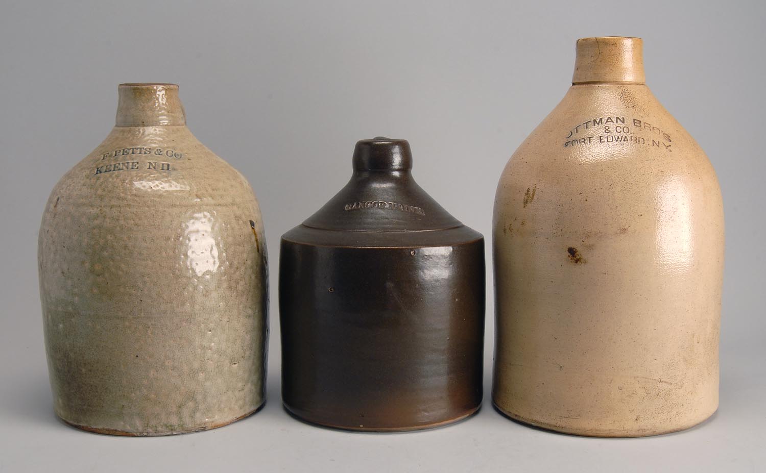 Appraisal: THREE STONEWARE JUGS from Maine New Hampshire and New York