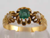 Appraisal: A French hallmarked carat gold emerald and seed pearl ring