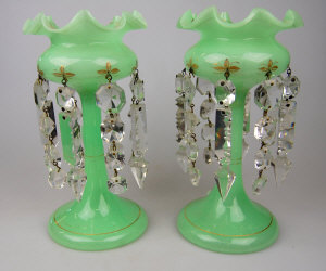 Appraisal: A pair of Victorian green opaque lustres with fluted bowls