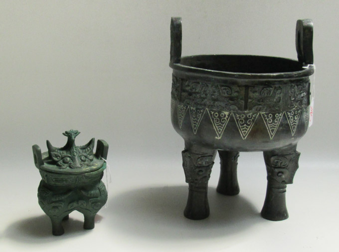 Appraisal: WO CHINESE BRONZE TRI-FOOTED VESSELS the larger a raised bowl