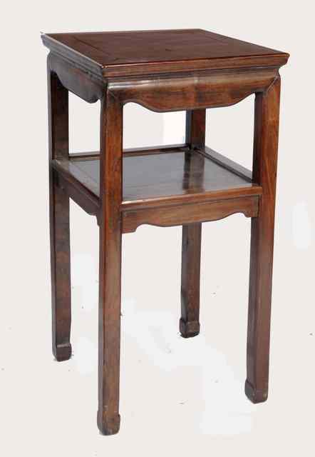 Appraisal: A CHINESE HARDWOOD URN STAND of two rectangular tiers th