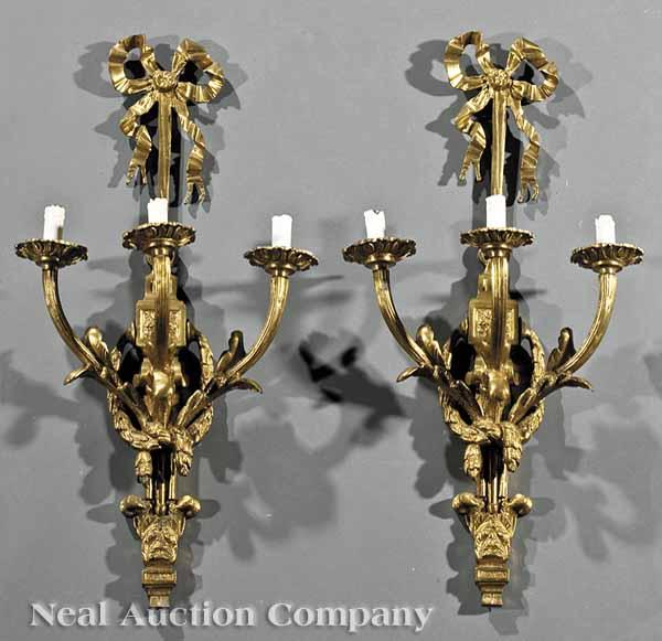 Appraisal: A Pair of Louis XVI-Style Brass Three-Light Sconces th c