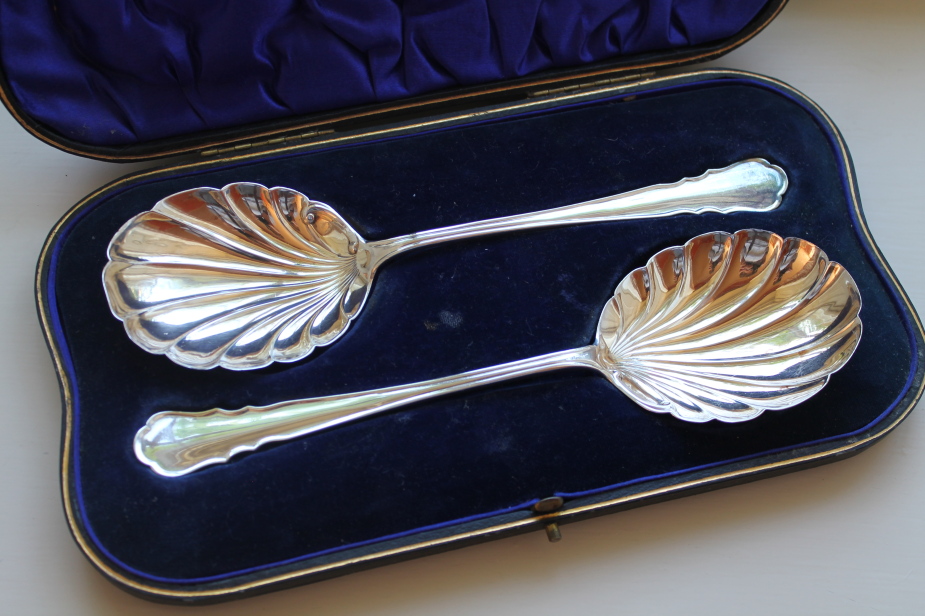 Appraisal: A pair of George V silver serving spoons with scalloped