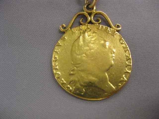 Appraisal: English Gold Coin Pendanton k chain '' long grams