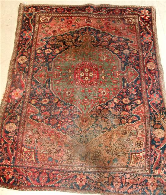 Appraisal: Two Persian rugs the first with a navy ground various