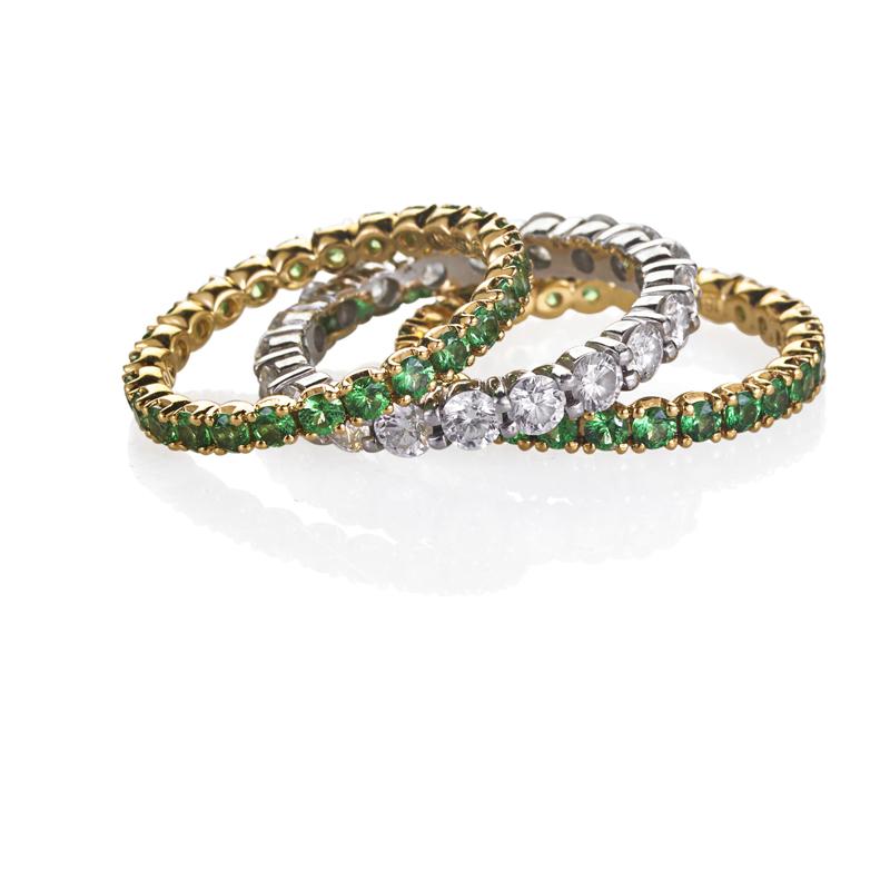 Appraisal: STACK OF THREE GEM-SET ETERNITY BANDS Platinum band with RBC