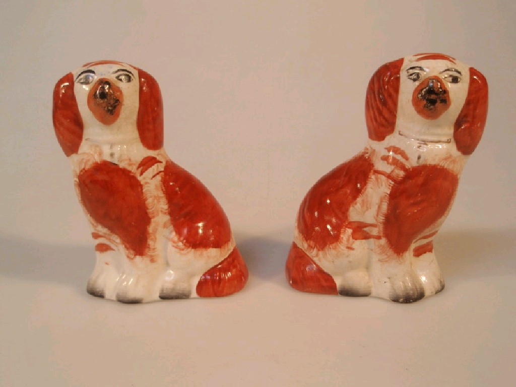 Appraisal: Pair of small Victorian Staffordshire comforter dogs in the form