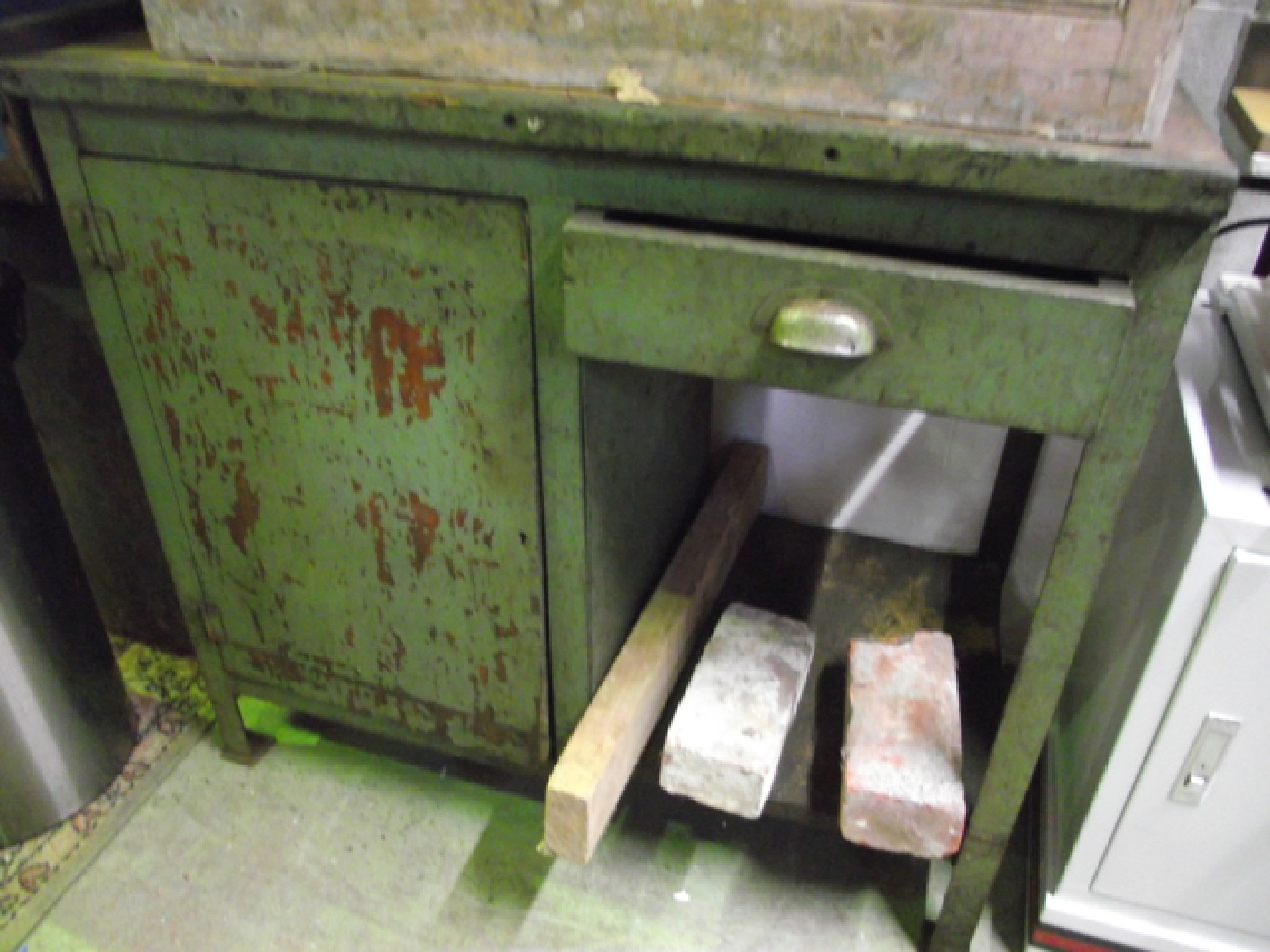 Appraisal: A vintage metal framed workbench with timber top frieze drawer