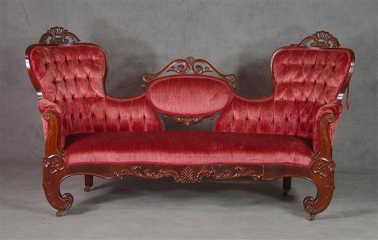 Appraisal: Walnut Victorian Sofa Late th Century Carved triple back above