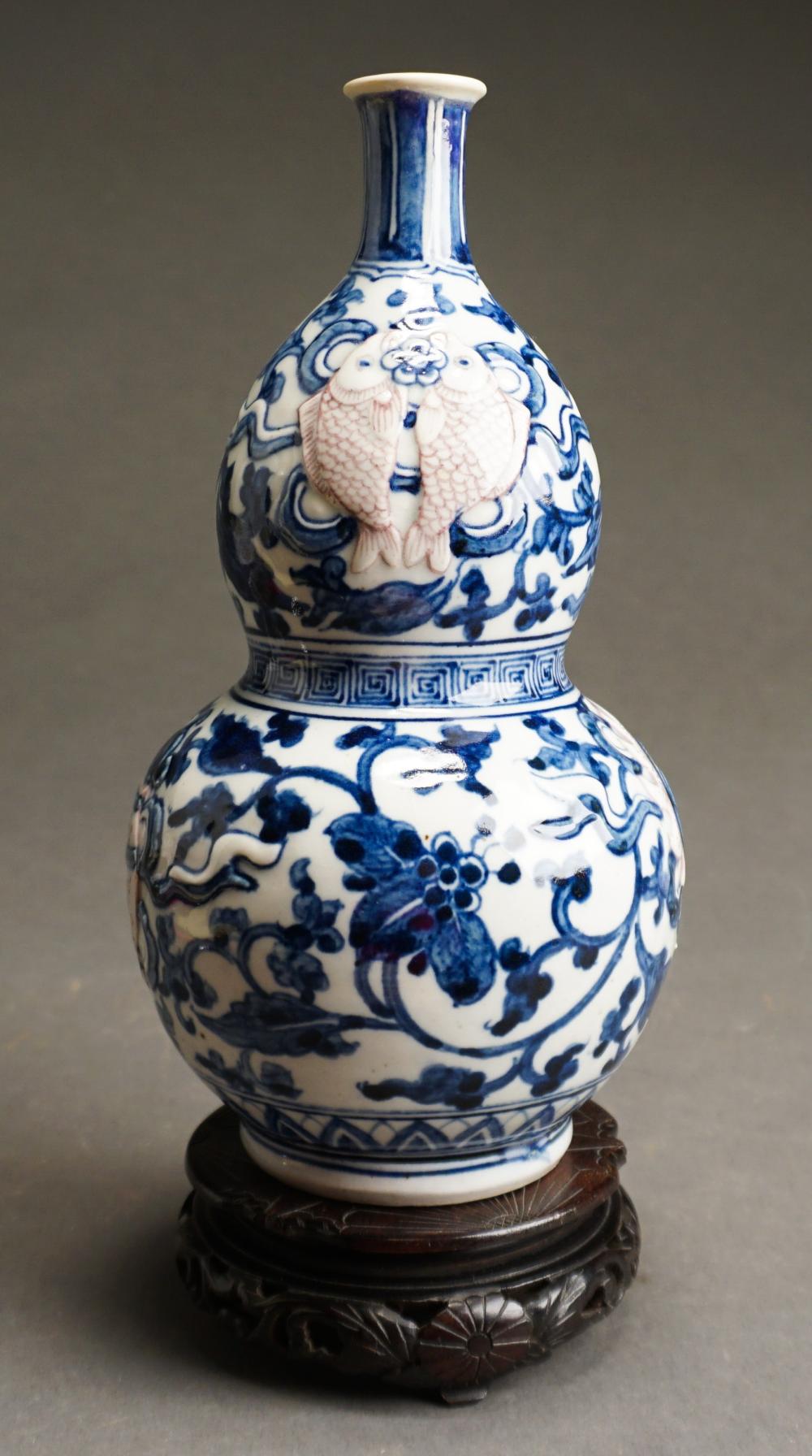 Appraisal: Japanese Blue and White and Raised Iron-Red Decorated 'Twin Fish'