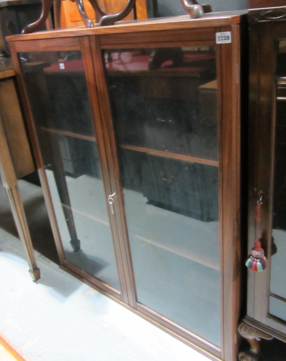 Appraisal: A th century rosewood two door glazed bookcase