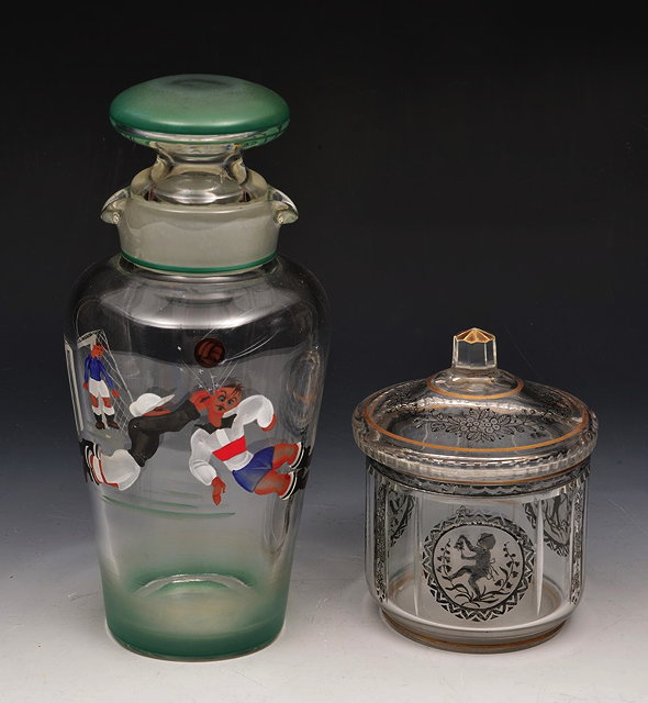 Appraisal: A GLASS COCKTAIL SHAKER AND STOPPER painted with a footballing