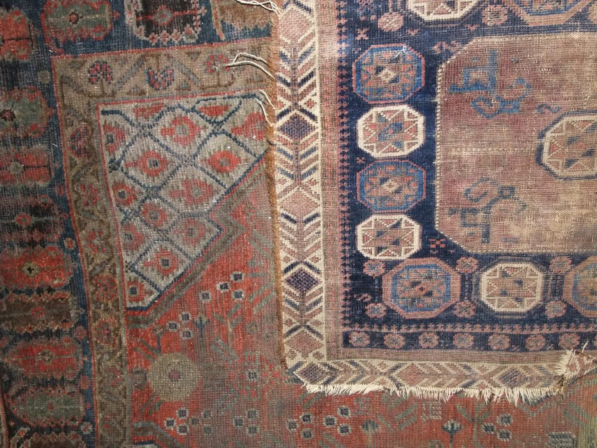 Appraisal: An eastern wool runner with multi-medallion centre upon a dark