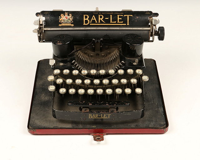 Appraisal: A VINTAGE BAR-LET MANUAL TYPEWRITER in red painted metal carrying