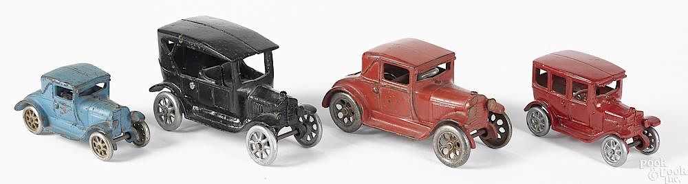 Appraisal: Four Arcade cast iron vehicles Four Arcade cast iron vehicles