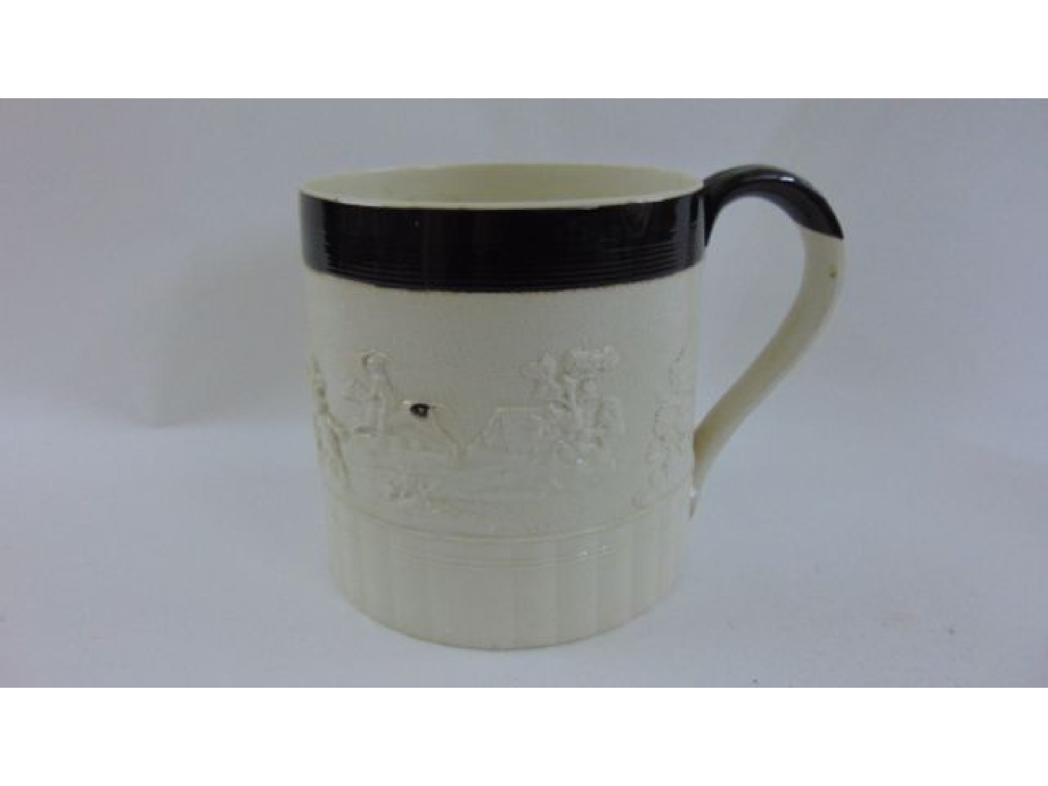 Appraisal: An early th century earthenware mug of half gallon capacity