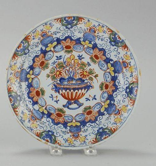 Appraisal: DELFT POLYCHROME POTTERY PLATE th CenturyWith central floral urn surrounded