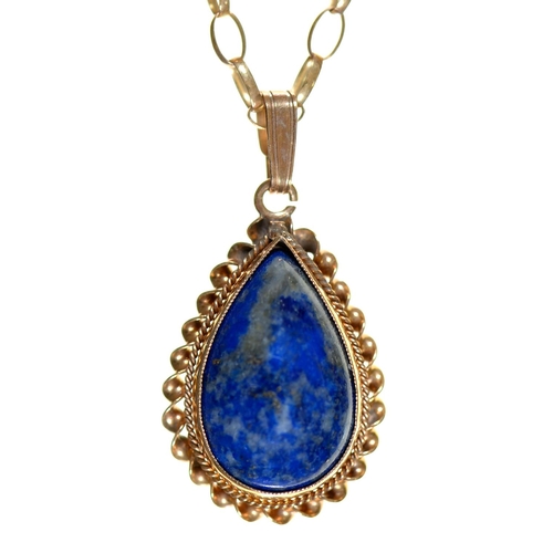 Appraisal: A tear shaped lapis lazuli pendant in gold mm and