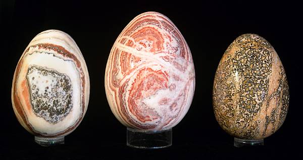 Appraisal: Group of Three Large Carved Eggs Two carved of a