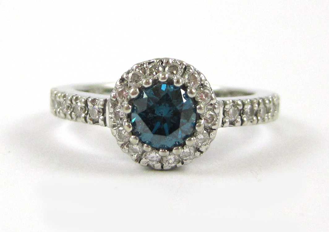 Appraisal: BLUE DIAMOND AND FOURTEEN KARAT WHITE GOLD RING with certificate