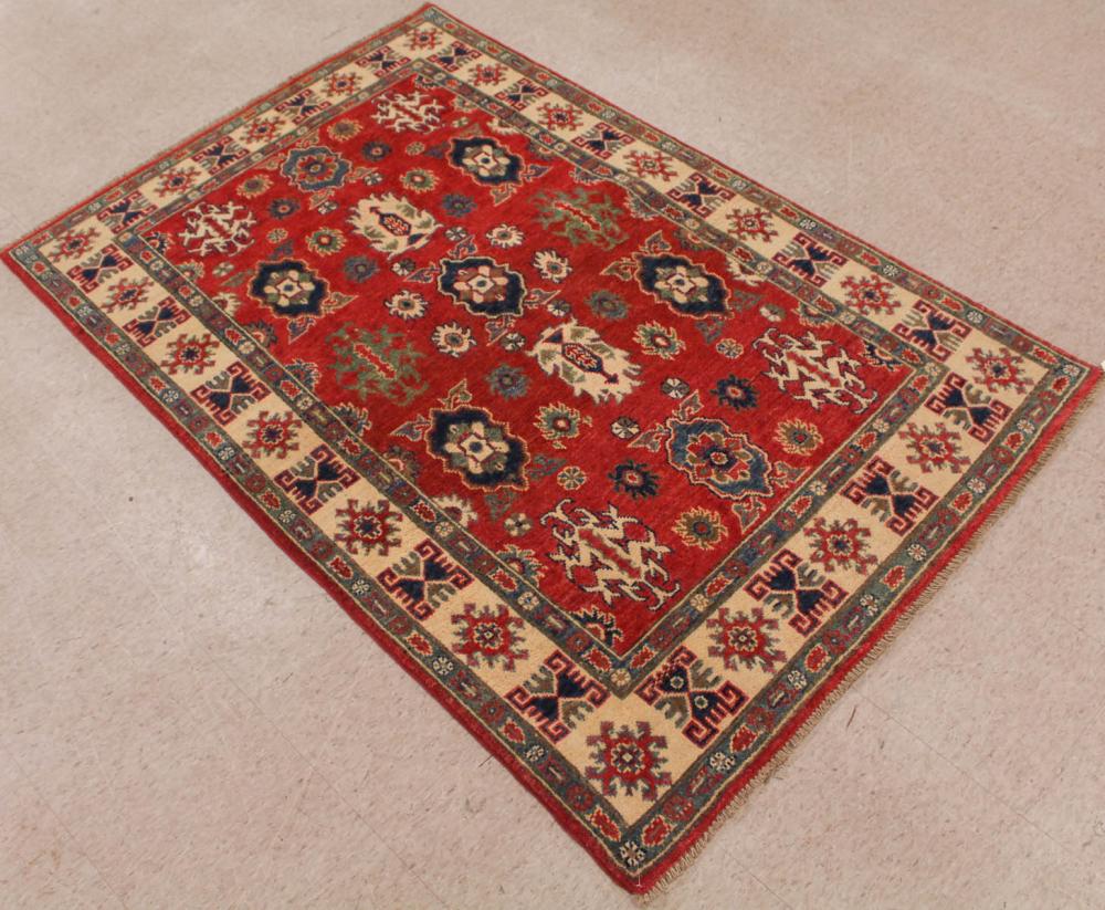 Appraisal: HAND KNOTTED ORIENTAL AREA RUG Pakistani-Persian repeating curvilinear elements on