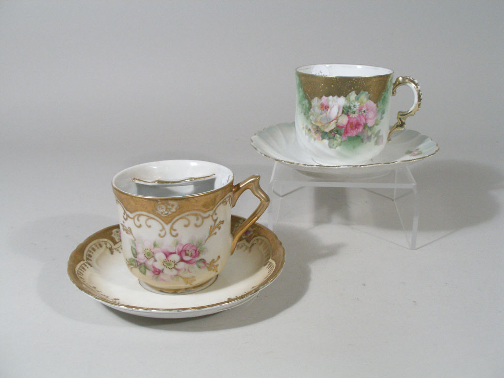 Appraisal: RS Prussia Two Mustache Cup and Saucers both w hand-painted