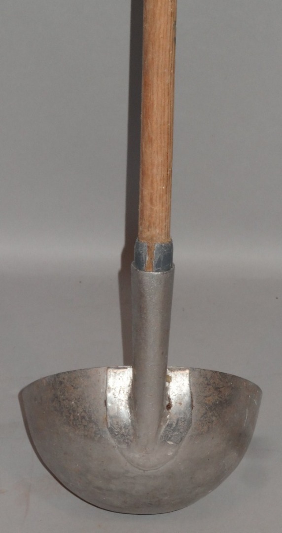 Appraisal: A long handled agricultural scoop with metal bowl end and